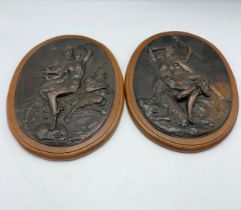 Pair Of Bronze Oak Mounted Plaques Depicting Nude Lady With The Devil. L 30cm.