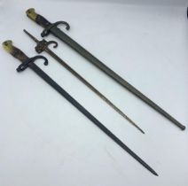 French 1874 pattern Gras bayonet with steel scabbard, the blade spine dated 1877 with makers mark,