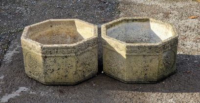 Pair of reconstituted Sandford stone octagonal planters with floral decoration, H 30cm x W 53cm,