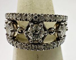 18ct white gold diamond ring, row of five graduated brilliant cut stones, the largest central