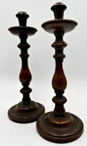 Pair of 19th century turned oak baluster candlesticks, 35cm high (2)
