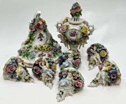 Set of six Sitzendorf porcelain wall brackets, with cherubs and bocage porcelain, each 12cm high,