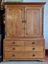 Antique two sectional oak housekeepers cupboard, the twin fielded panel doors flanked by turned