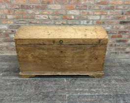 Large antique pine dome top trunk of tapered form with wrought iron handles, H 72cm x W 123cm x D