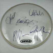 Judas Priest Signed drum skin, 42 cm diameter, with five signatures. Gifted to vendor on the tour.