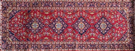 Persian Kashan runner, traditional four medallion design on red ground, 290 x 100cm