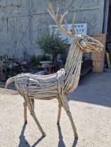 A large impressive driftwood sculpture of a stag, 212cm high
