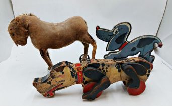 Assortment of pull along dog toys to include wooden Fisher Price & hay stuffed examples (3)