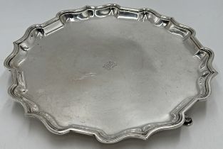 Good quality Edwardian silver salver, serpentine rim on hoof feet, maker Lambert & Co, London