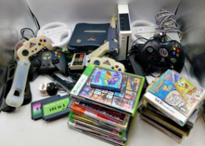 Assortment of consoles, games & accessories. Includes a Nintendo Wii console with controllers and