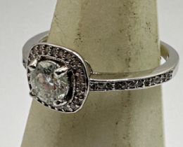 Art Deco style 18ct white gold diamond ring, central 0.5ct stone framed by further chip diamonds,