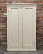 Painted pine wardrobe with two cupboard doors enclosing a shelved interior and two hooks for