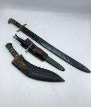 Late 19th/early 20th century machete with two piece horn handle and leather scabbard, 50cm blade,