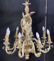 Good quality Italian carved softwood eight branch chandelier, centrally decorated with a monkey