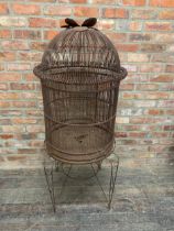 Large vintage wire bird cage on stand with Lotus flower top. H 150cm.