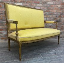 Louis XVI gilt wood and gesso salon couch, recently upholstered with marbled yellow fabric and