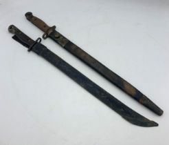 Two First World War British 1907 pattern bayonets with fullered blades and wooden grips, both