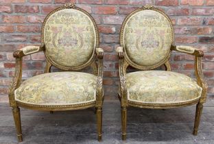 Pair of period Louis XVI gilt wood and gesso shield back futiles with good silk work stitched