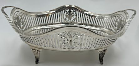 Good quality Edwardian silver twin handled basket with pierced sides on four fluted feet, maker