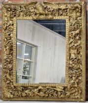 Good Antique Baroque giltwood wall mirror, carved with bird and flowers, 118 x 97cm (af)