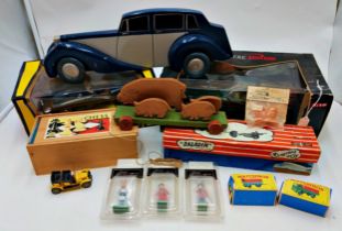 Mixed assortment of games & toys. Includes boxed cars, military vehicles & wooden toys.