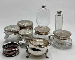 Pair of Art Deco silver topped glass dressing jars, with three further plated topped dress jars, two