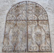 Pair of arched wrought iron gates with pierced scrollwork detail, H 185cm x W 148cm