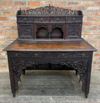 19th century Anglo Indian padauk wood writing desk, the raised back with gallery and arrangement