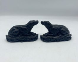 Pair of small cast iron door stops in the form of recumbent hounds, H 10cm