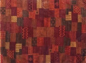 Hand knotted Indian Indo Loristan full pile wool carpet with patchwork type design, red ground,