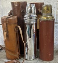 Pair of vintage leather huntsman flask cases, each containing a Thermos flask, believed to