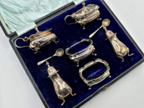 1920s silver cased cruet set, comprising two mustards, salts, peppers and spoons, maker Walker and