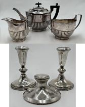 Pair of silver candlesticks, 13cm high with a further silver capstan inkwell, unusual 925 floral