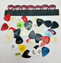 A large collection of 53 guitar pics from many great named guitar players including Eric Clapton,