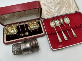 Collection of silver to include cased pair of lobed salts and spoons, three napkin rings and four