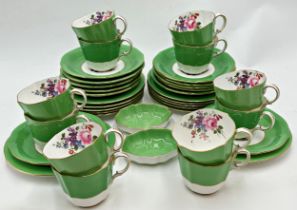 Royal Crown Derby porcelain part tea service, floral bouquets with green ground and gilt highlights,