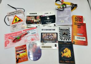 A collection of band tour related paper passes including Glastonbury 2013 wristbands and vehicle