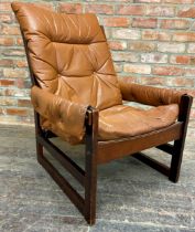 Norwegian teak framed lounge chair with tan leather upholstery, 93cm H x 71 W x 73 D