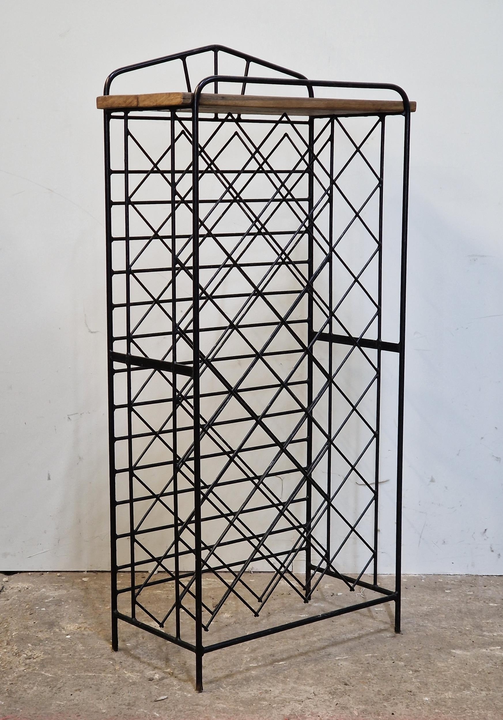 Contemporary black metal wine rack of arched form, H 131cm x W 63cm x D 32cm