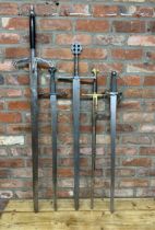 Four replica broadswords / claymores, one marked 'Toledo made in Spain' together with a replica '
