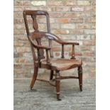 Good mid 19th century solid mahogany spoon back library chair with dished seat and turned front legs