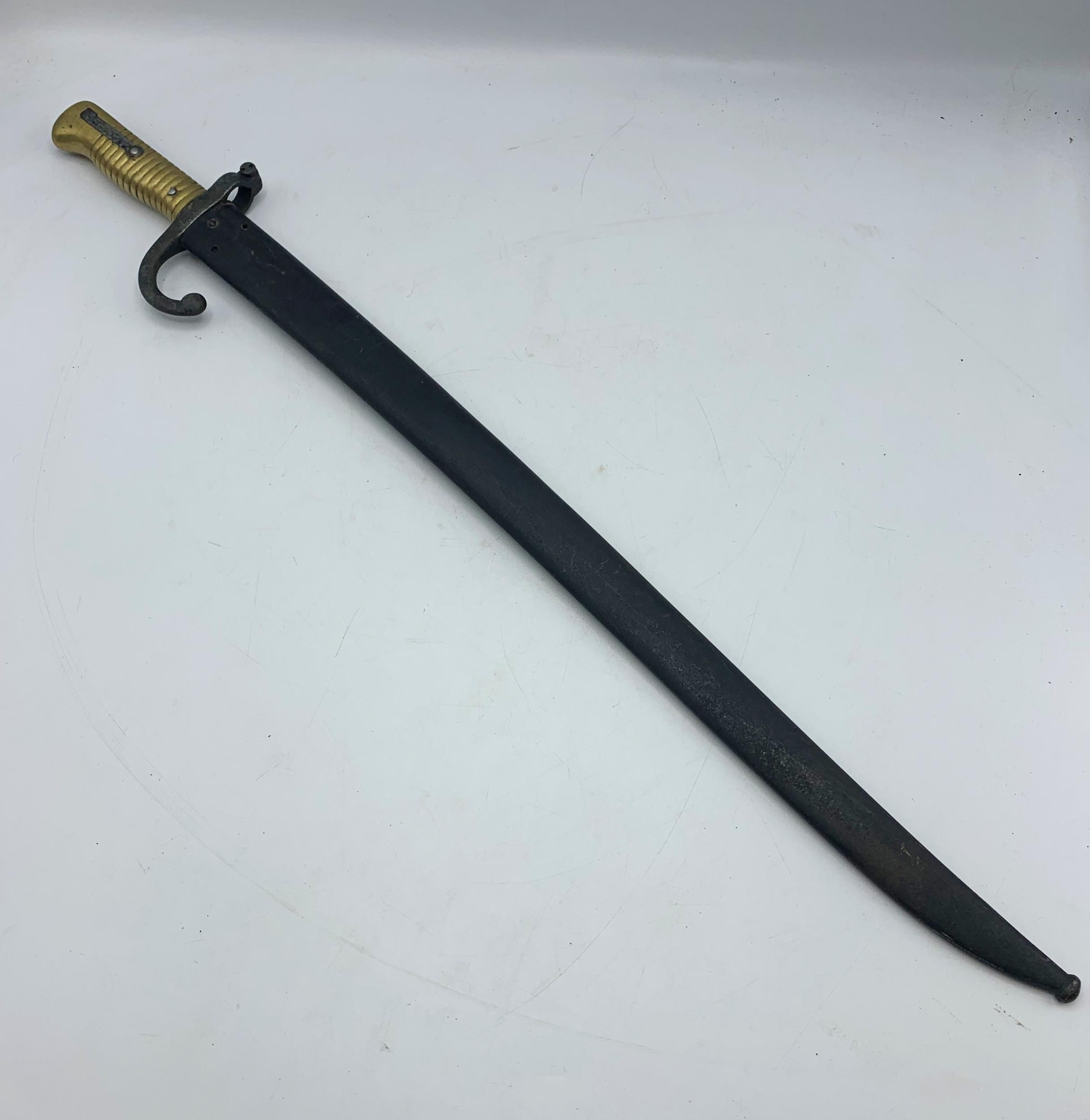 A 19th Century French 1866 pattern Chassepot bayonet with fullered Yataghan style blade, ribbed