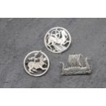 Two Scottish Ortak Maeshowe Dragon silver brooches, with a further Shetland longboat silver