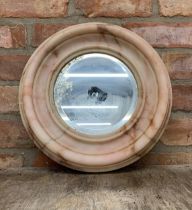 Circular alabaster framed wall mirror with mottled finish, D 38cm