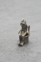 Novelty silver cigar cutter charm in the form of a seated monkey, 3.5cm high