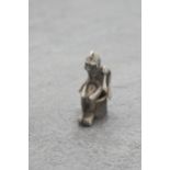 Novelty silver cigar cutter charm in the form of a seated monkey, 3.5cm high