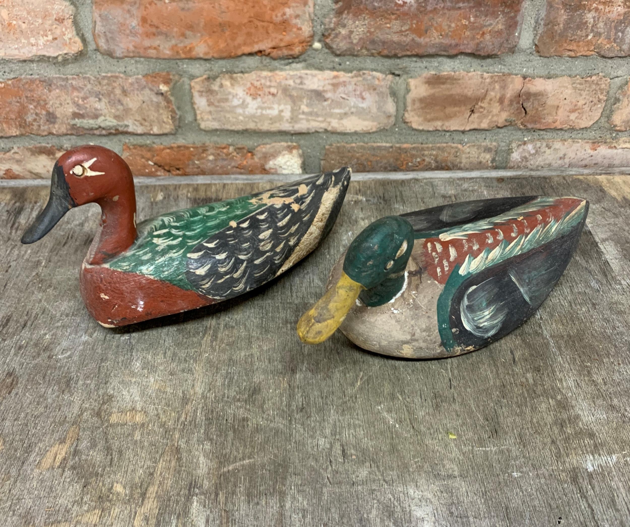 Pair of hand painted carved wooden Folk Art decoy ducks (2)