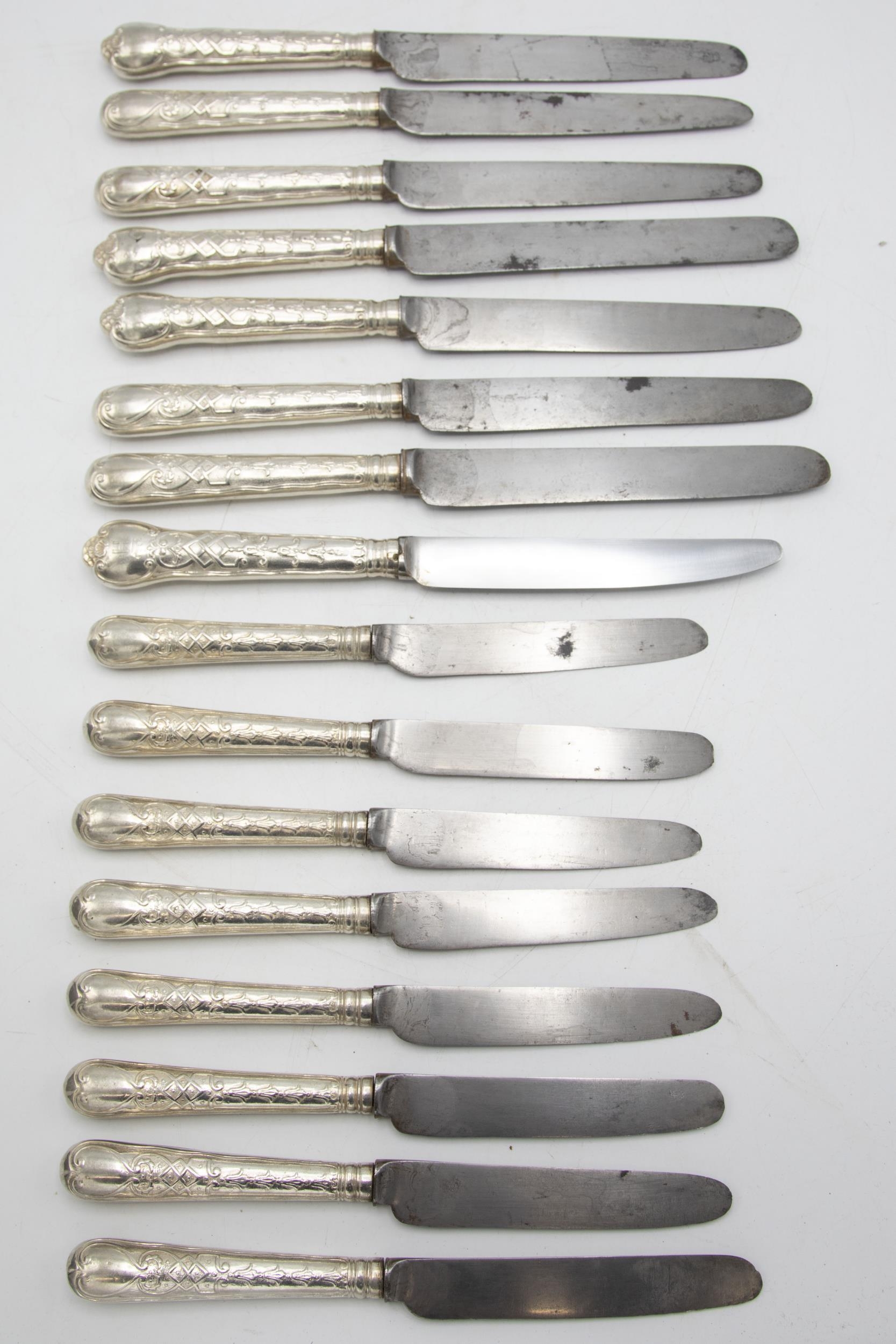 Good quality set of eight silver cannon handled table and dessert knives, the handle embossed with