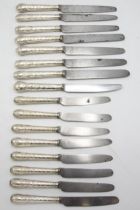 Good quality set of eight silver cannon handled table and dessert knives, the handle embossed with
