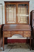 19th century mahogany Regency style tambour front bureau bookcase, with raised twin glass doors,